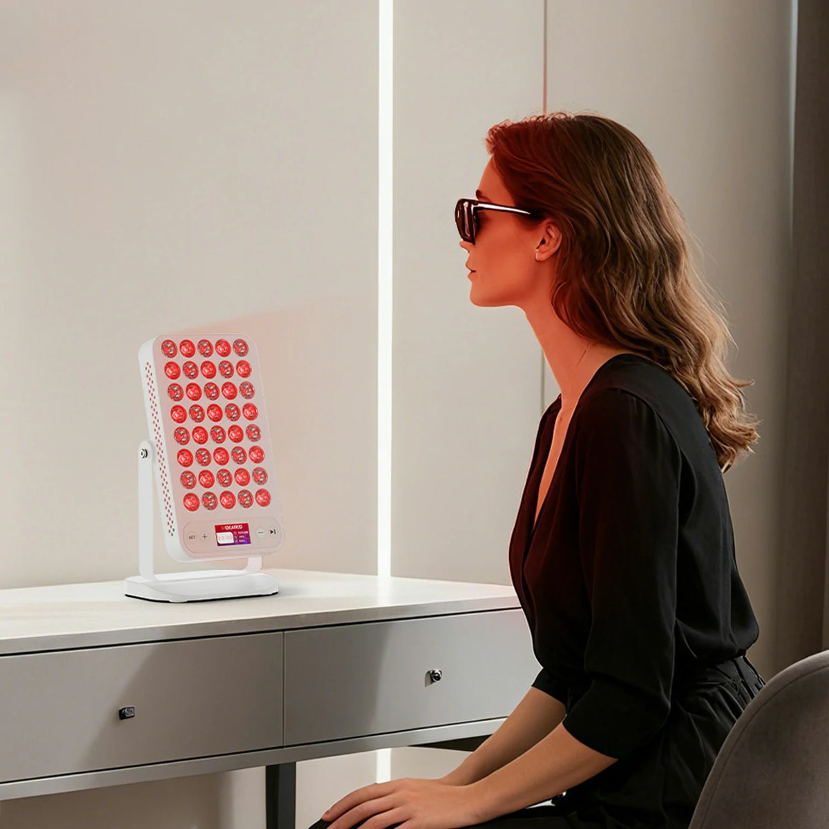 Person using the RTL40A portable red light therapy panel