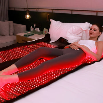 Person using the TLB2000-K red light therapy sleeping bag