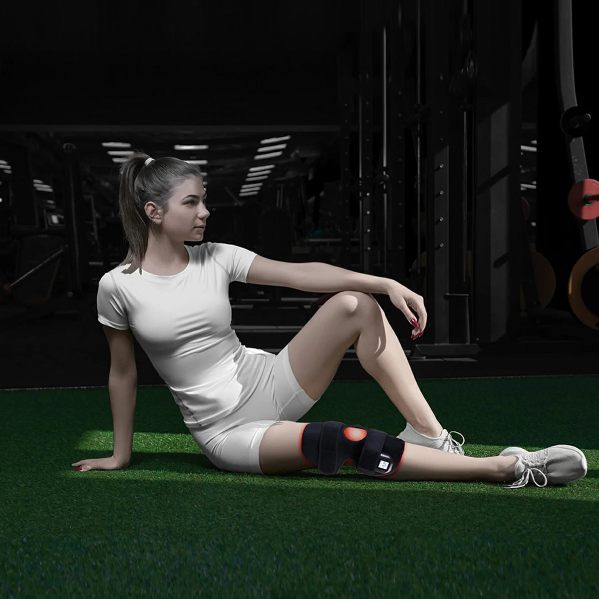 Person using the TLB60-C4 red light therapy knee wrap